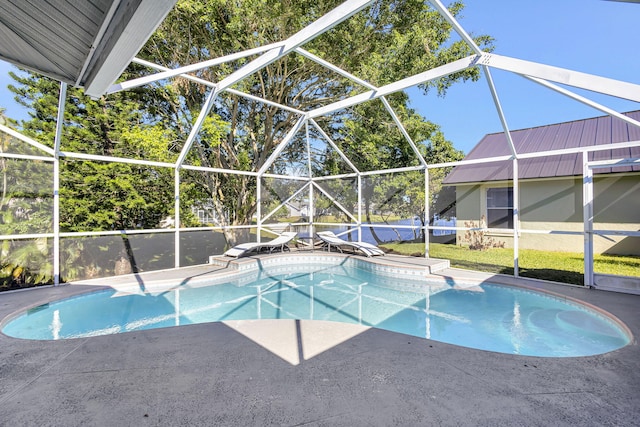 view of pool featuring a lanai and a patio