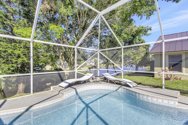 view of swimming pool with a lanai