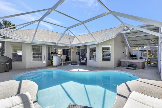 view of swimming pool featuring a patio, a hot tub, grilling area, and a lanai