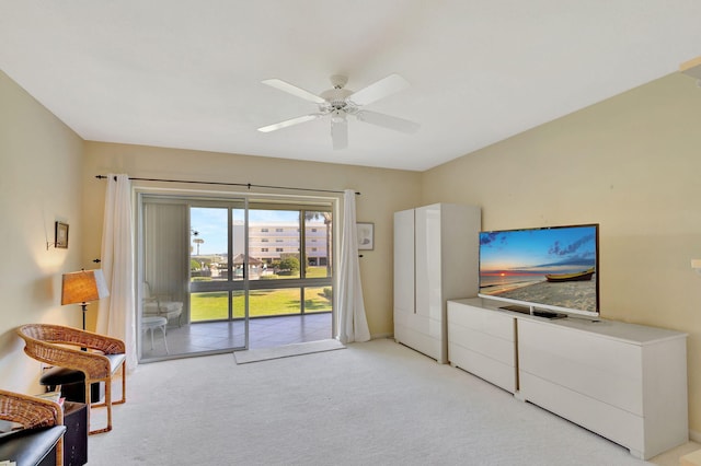 living room with ceiling fan and light colored carpet