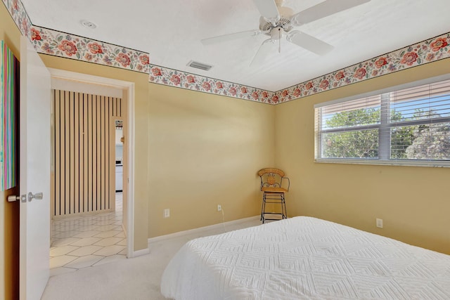 bedroom featuring ceiling fan and light colored carpet