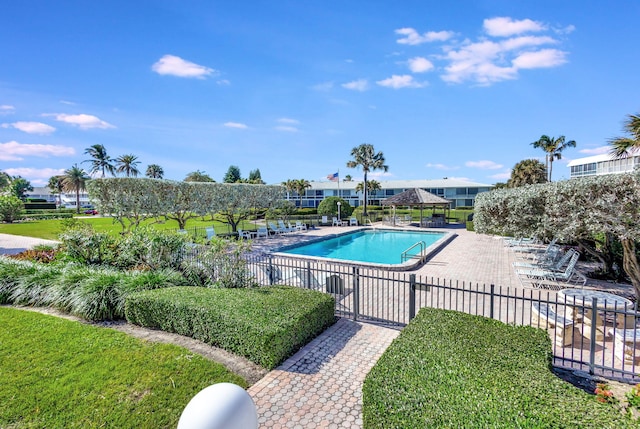 view of swimming pool with a patio