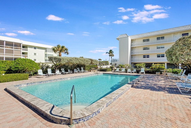 view of swimming pool featuring a patio area