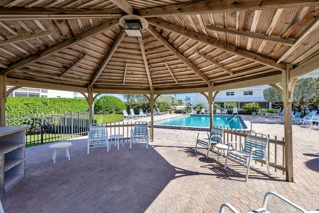 view of swimming pool featuring a gazebo and a patio area