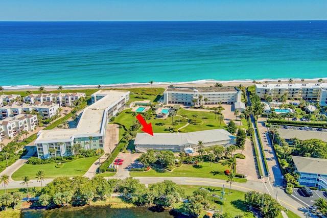 aerial view featuring a water view and a beach view