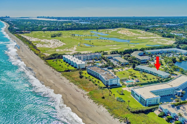 bird's eye view featuring a water view and a view of the beach