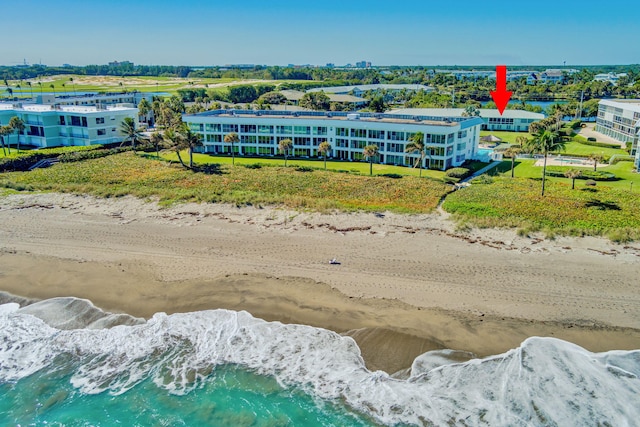 drone / aerial view featuring a view of the beach and a water view