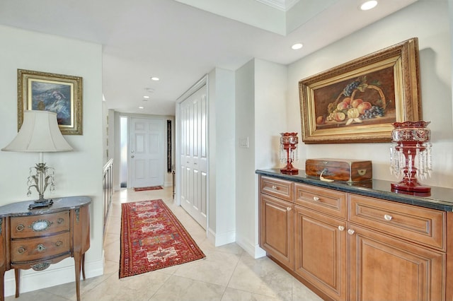 hall featuring light tile patterned floors