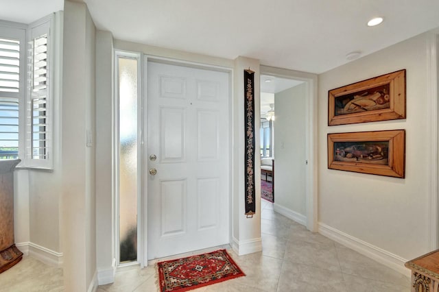 foyer entrance featuring light tile patterned floors