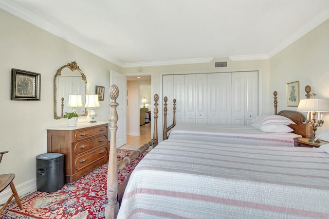 bedroom featuring a closet and crown molding