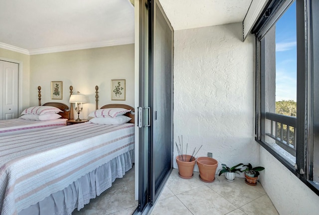 tiled bedroom featuring a closet and crown molding