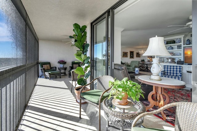 balcony featuring ceiling fan