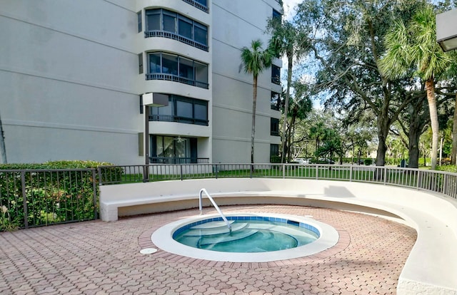 view of pool with a community hot tub