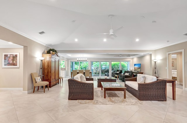 living room featuring ceiling fan and crown molding