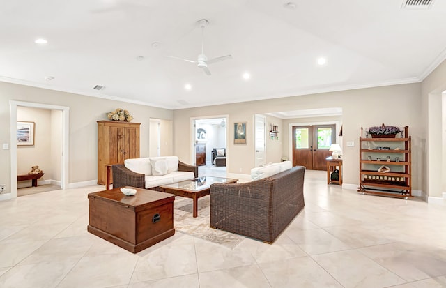 living room featuring ceiling fan, ornamental molding, and french doors