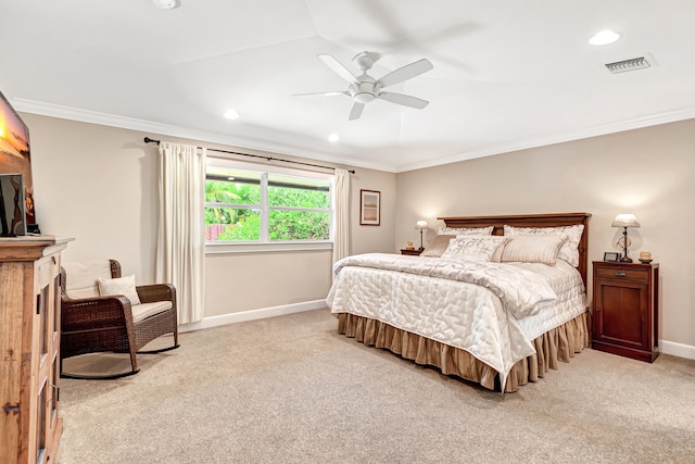 bedroom with ceiling fan, ornamental molding, and light colored carpet