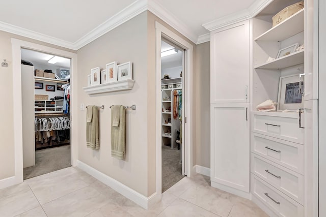 bathroom with tile patterned floors and crown molding