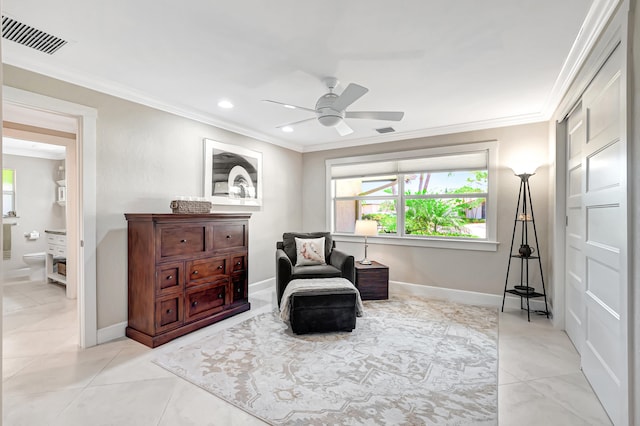 sitting room featuring ceiling fan and ornamental molding