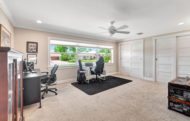 carpeted office featuring ceiling fan and crown molding