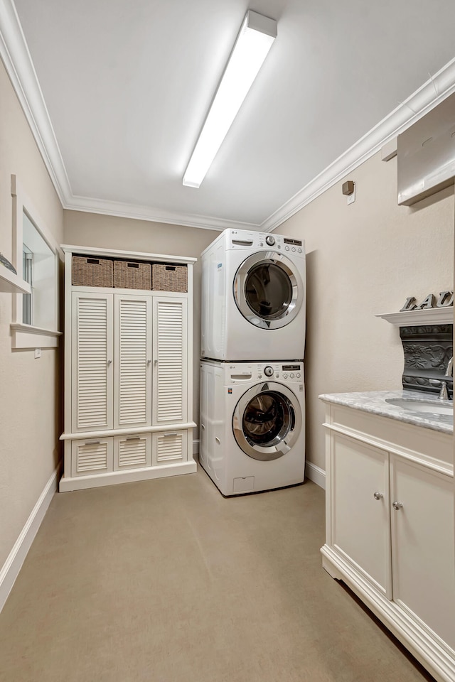 washroom featuring cabinets, stacked washer and dryer, sink, ornamental molding, and light colored carpet