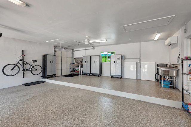 garage with ceiling fan and a wall unit AC