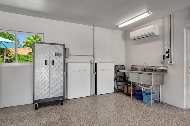 garage with a wall mounted AC and sink