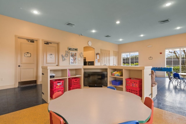 game room with a healthy amount of sunlight, visible vents, and recessed lighting