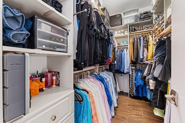 spacious closet with wood finish floors