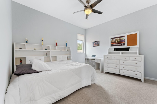 carpeted bedroom featuring vaulted ceiling and ceiling fan