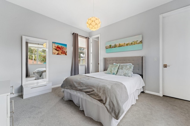 bedroom with light colored carpet