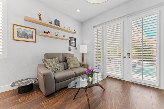 living room featuring dark hardwood / wood-style flooring and plenty of natural light