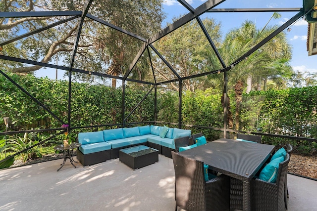 view of patio with outdoor dining space, a lanai, and an outdoor hangout area