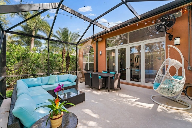 view of patio / terrace featuring glass enclosure, an outdoor hangout area, and french doors