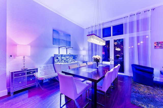 dining area featuring crown molding and wood finished floors