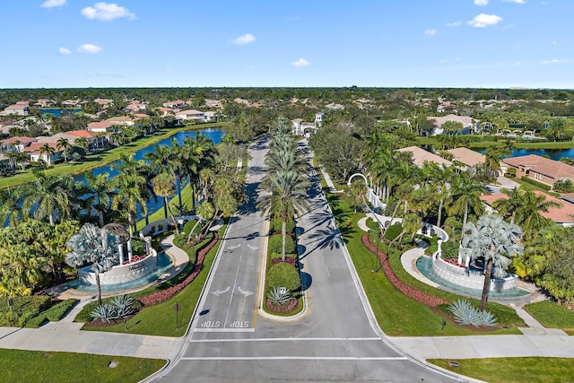 birds eye view of property featuring a water view and a residential view