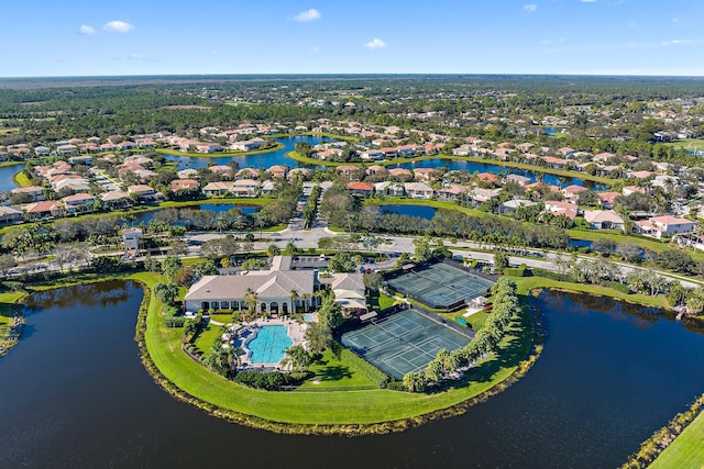 drone / aerial view featuring a residential view and a water view