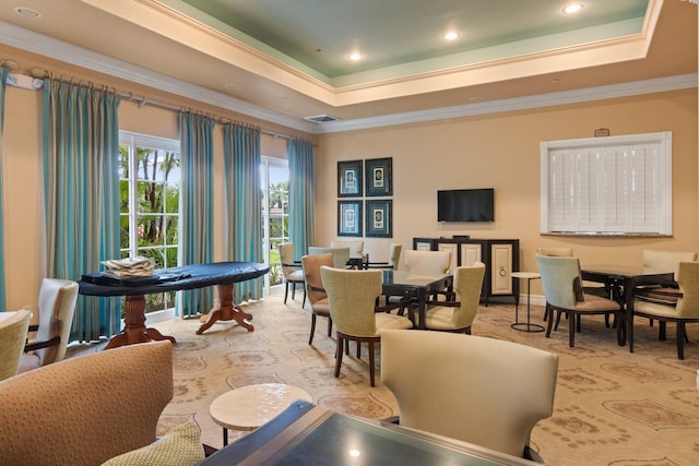 living area featuring visible vents, ornamental molding, a raised ceiling, and recessed lighting