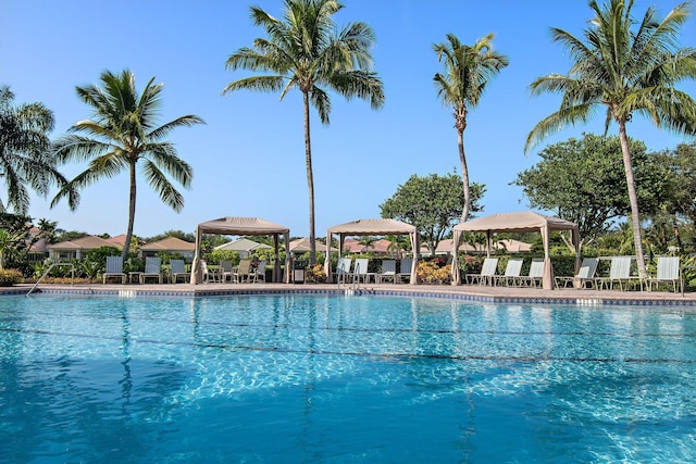 pool with a patio area and a gazebo