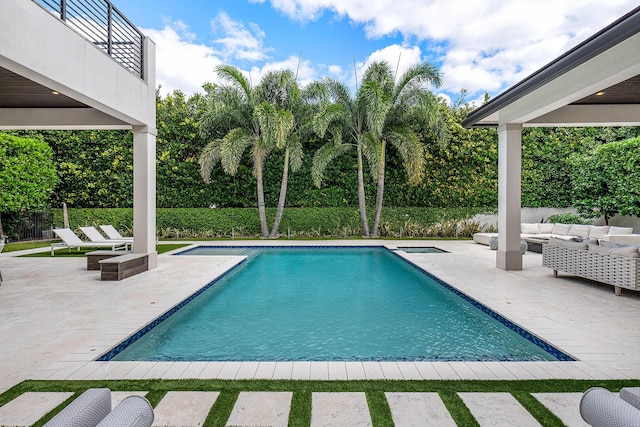 view of swimming pool with an outdoor hangout area and a patio