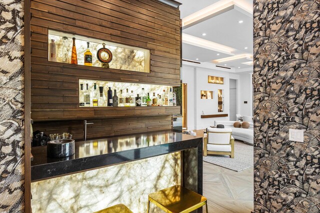 bar featuring light parquet floors