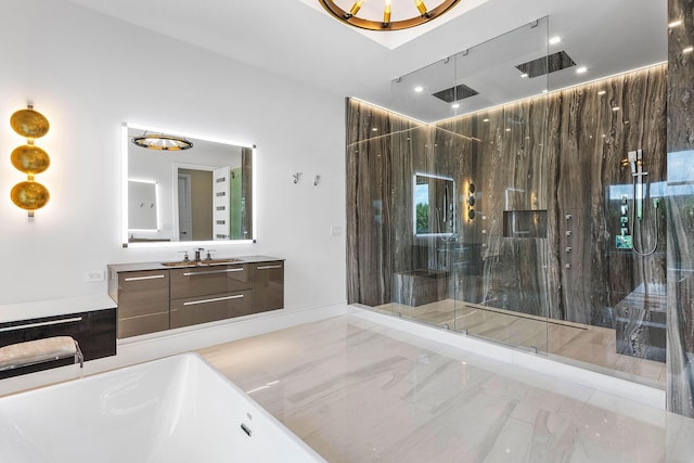 bathroom with tiled shower and vanity