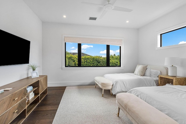 bedroom with ceiling fan and dark wood-type flooring