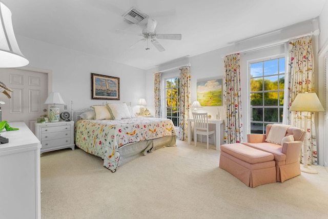 carpeted bedroom featuring access to outside and ceiling fan