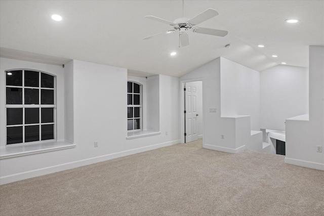 interior space featuring ceiling fan and lofted ceiling