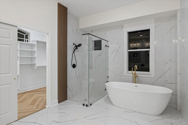 bathroom with separate shower and tub and parquet floors