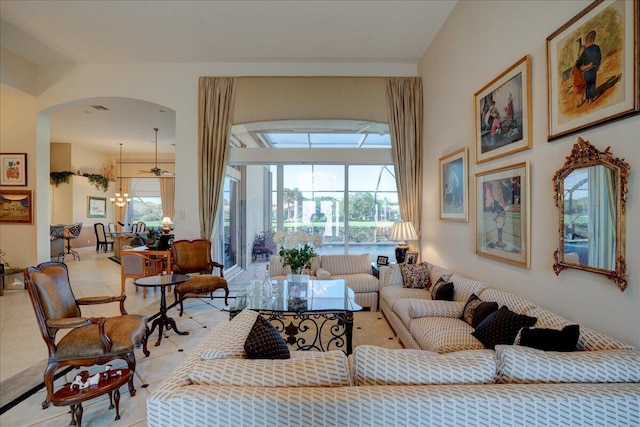 living room featuring light tile patterned floors and an inviting chandelier