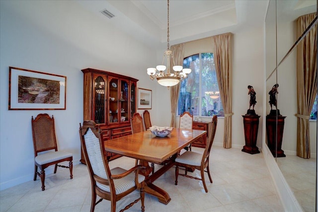 tiled dining area with a notable chandelier