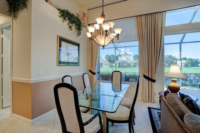 tiled dining space with an inviting chandelier