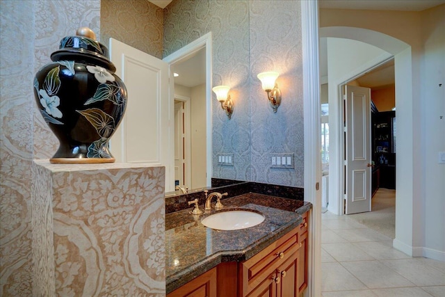 bathroom with tile patterned flooring and vanity