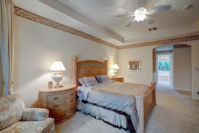 carpeted bedroom featuring ceiling fan and ornamental molding